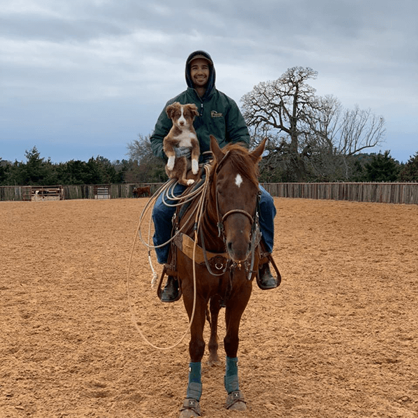 Dusty Anderson - photo of team roper with this puppy and horse proud to be on Team RenoVo